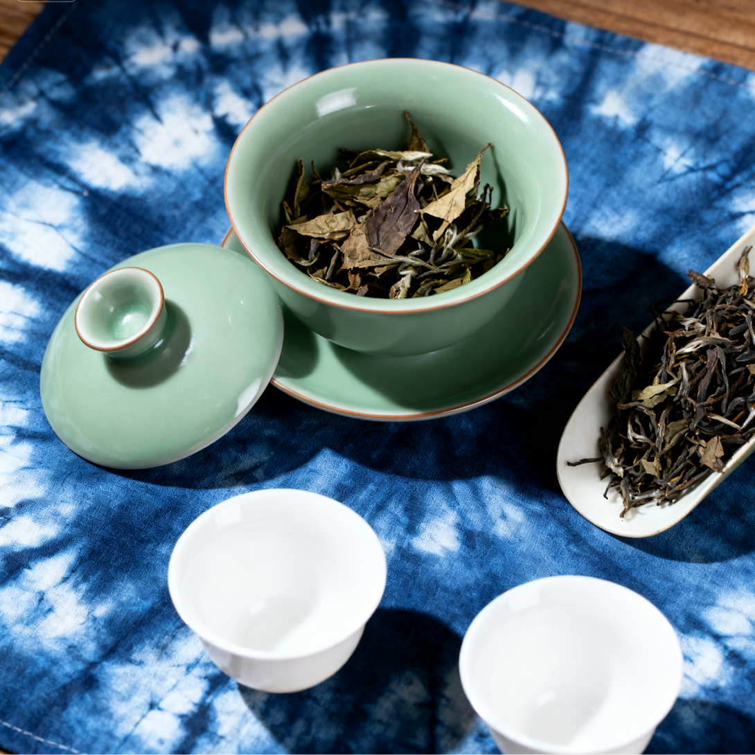 2002 Fuding White Eyebrow Shoumei White Tea cake pressed leaves texture